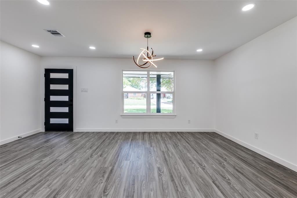 11341 Gatewood Place Dallas, TX 75218 - Photo 3 of 29 a view of wooden floor and windows in a room