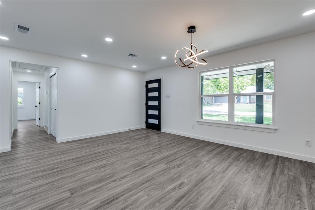 11341 Gatewood Place Dallas, TX 75218 - Photo 5 of 29 a view of an empty room with wooden floor and a window