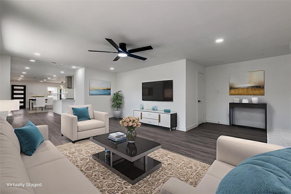 11341 Gatewood Place Dallas, TX 75218 - Photo 6 of 29 a living room with furniture a flat screen tv and a fireplace