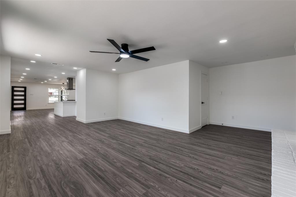 11341 Gatewood Place Dallas, TX 75218 - Photo 7 of 29 a view of an empty room with wooden floor and a window