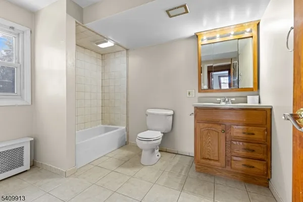 a bathroom with a toilet a sink and bathtub