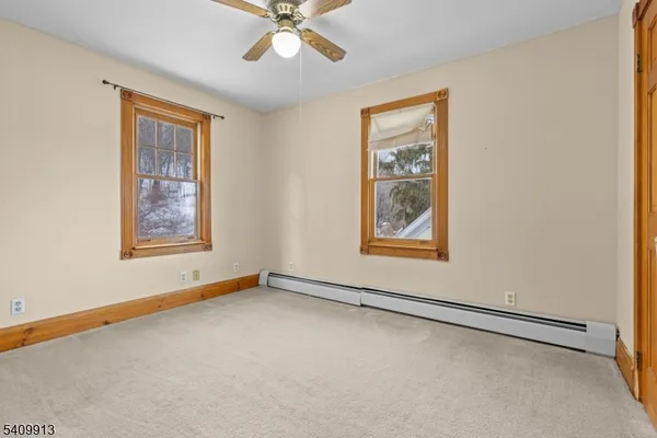 a view of room with window and ceiling fan