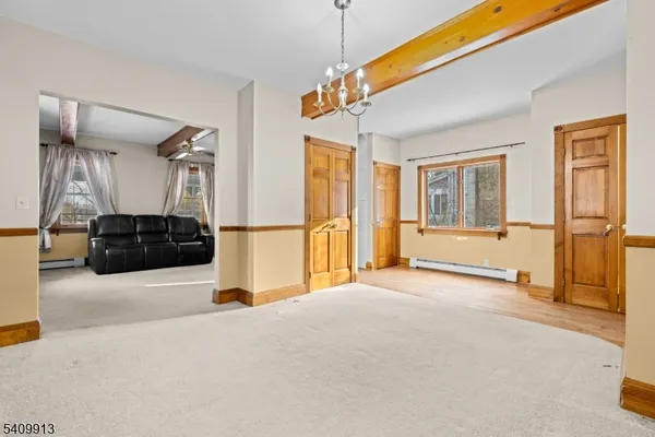 a view of a livingroom with furniture and a ceiling fan