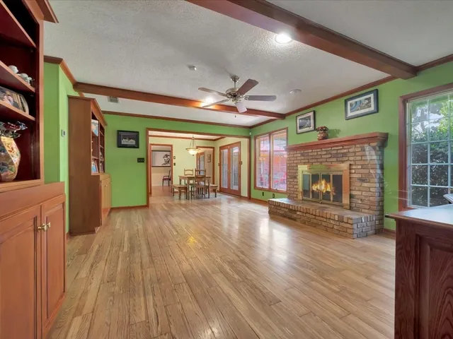 a view of a hall with wooden floor
