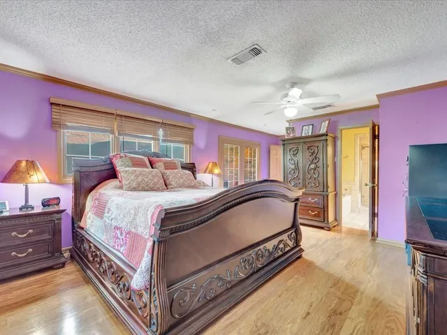 a bed room with a bed and a window