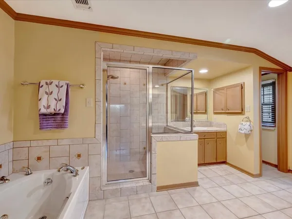 a bathroom with a granite countertop sink a toilet and shower