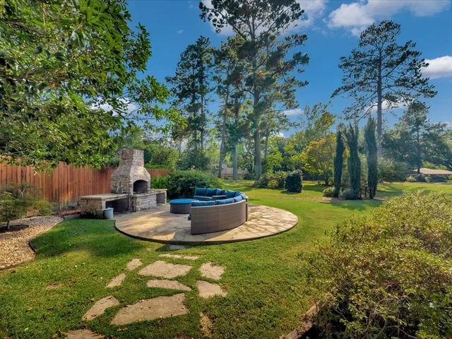 a view of a backyard with sitting area