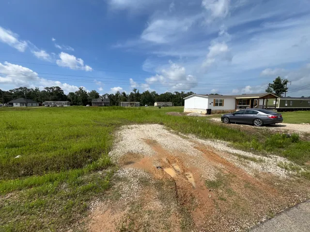 a view of lake and houses with outdoor space