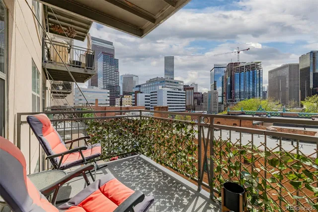 a view of a balcony with chairs