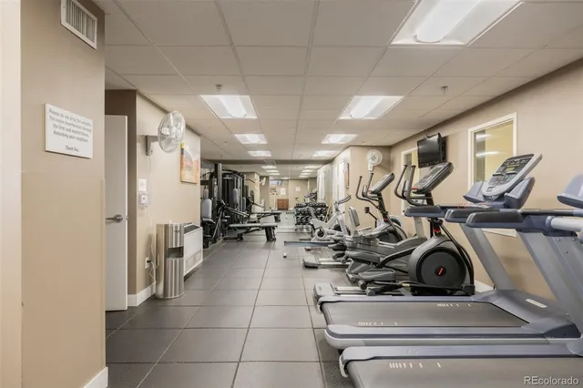 a view of living room filled with furniture and large window