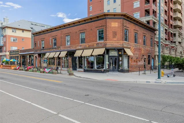 a view of a balcony with table and chairs