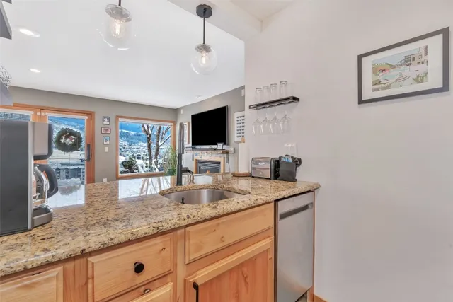 a kitchen with stainless steel appliances granite countertop a sink and cabinets