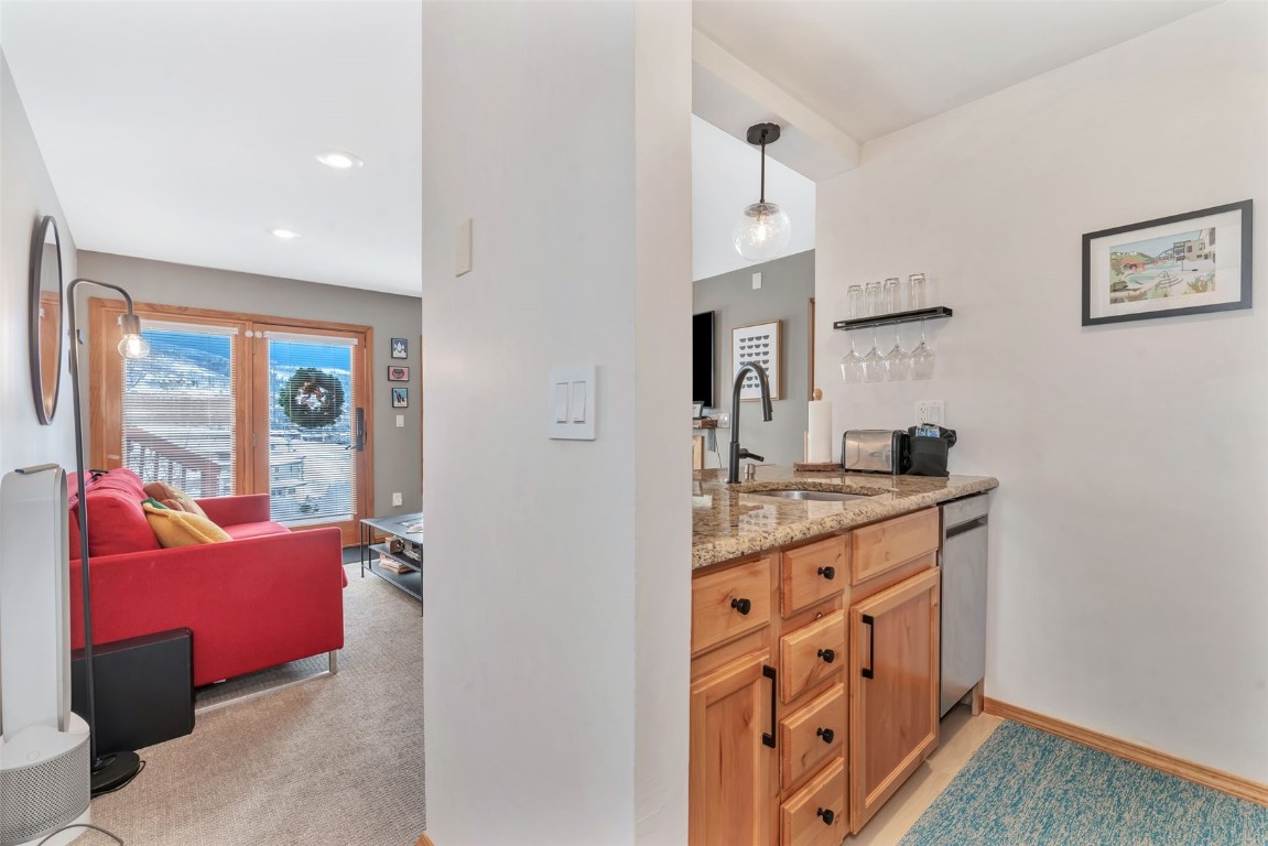 1800 Burgess Creek Road, Unit 205 Steamboat Springs, CO 80487 - Photo 18 of 37 a spacious bathroom with double vanity and a mirror