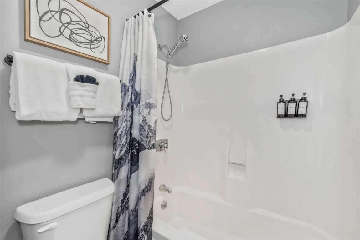 1800 Burgess Creek Road, Unit 205 Steamboat Springs, CO 80487 - Photo 22 of 37 a bathroom with a toilet and a shower