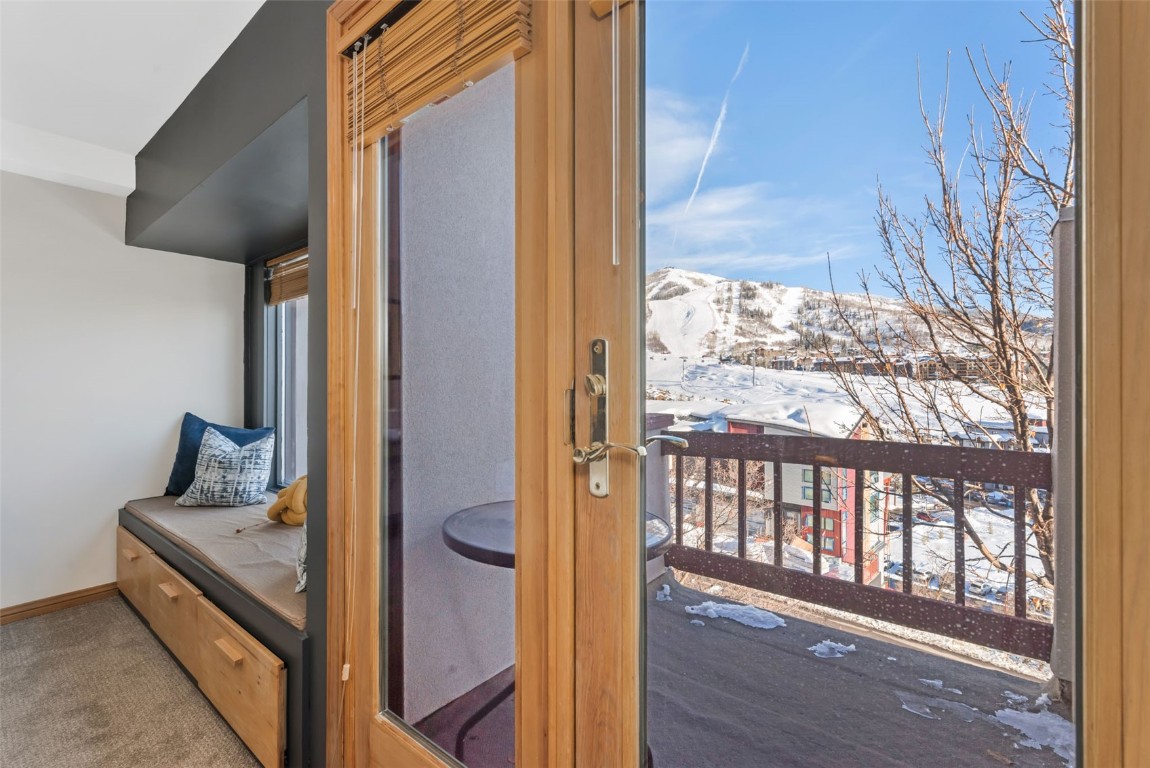 1800 Burgess Creek Road, Unit 205 Steamboat Springs, CO 80487 - Photo 29 of 37 a view of a balcony wooden floor and furniture