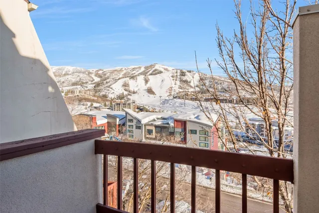 a view of a chairs and tables in a city