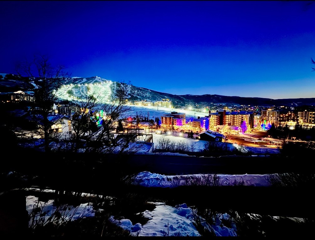 1800 Burgess Creek Road, Unit 205 Steamboat Springs, CO 80487 - Photo 32 of 37 a view of a chairs and tables in a city