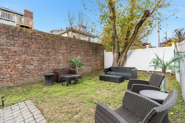 a backyard of a house with seating space