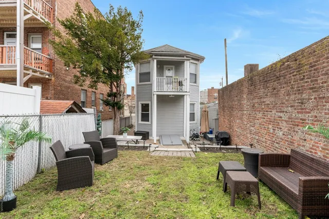 a view of a patio with couches chairs and a fire pit