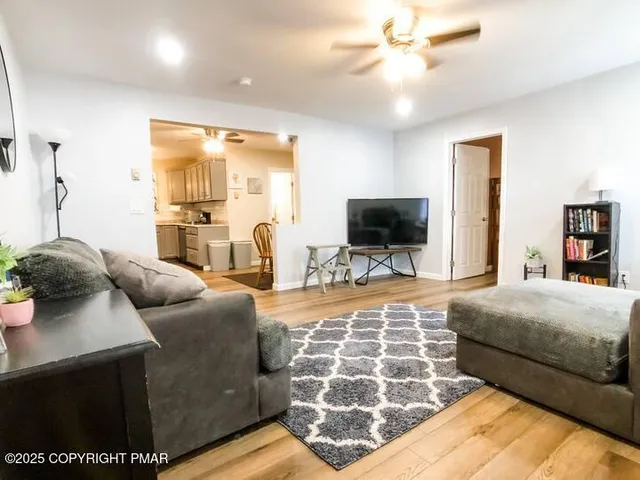 a bedroom with a bed and a flat screen television