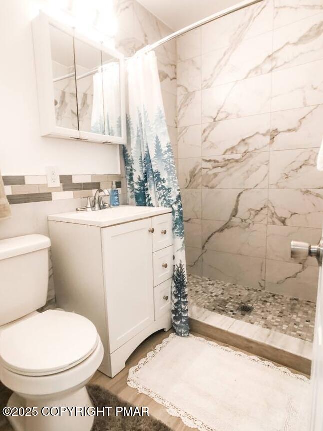 36 Main Street Delaware Water Gap, PA 18327 - Photo 15 of 37 a bathroom with a sink a toilet and vanity