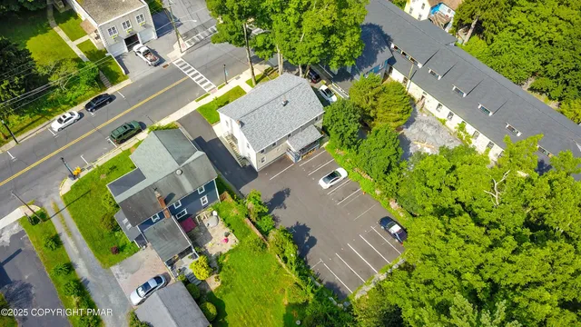 an aerial view of a house with a garden