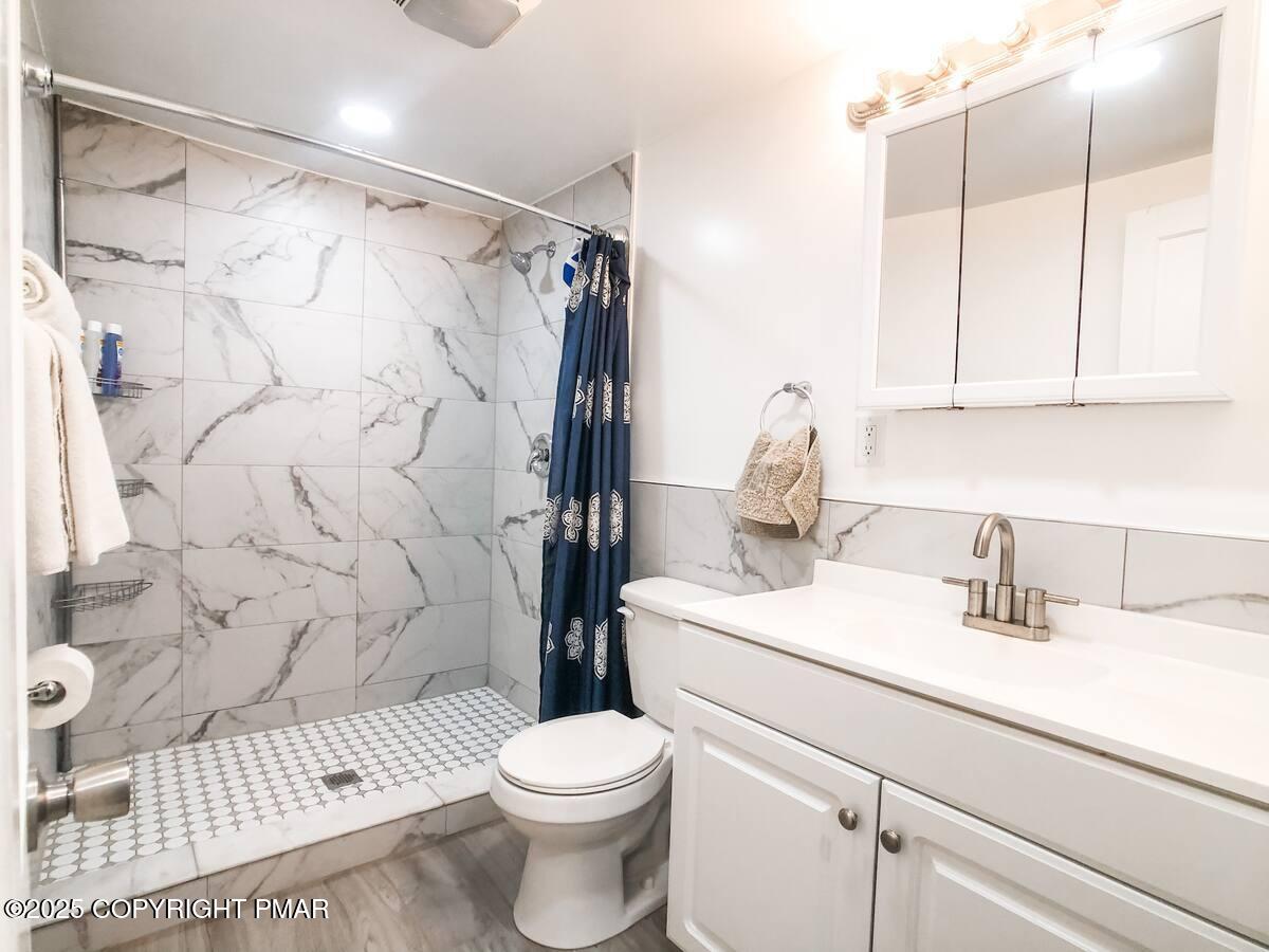 36 Main Street Delaware Water Gap, PA 18327 - Photo 28 of 37 a bathroom with a sink toilet and shower