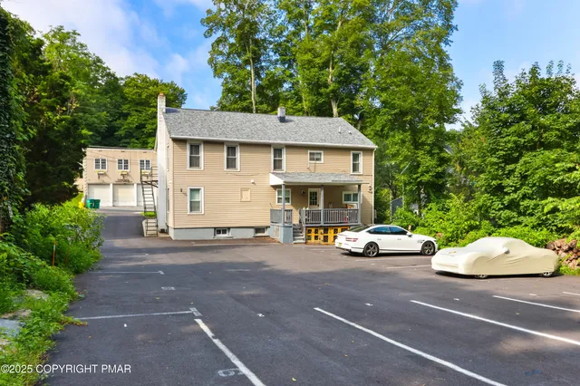 a view of a car parked in front of a house
