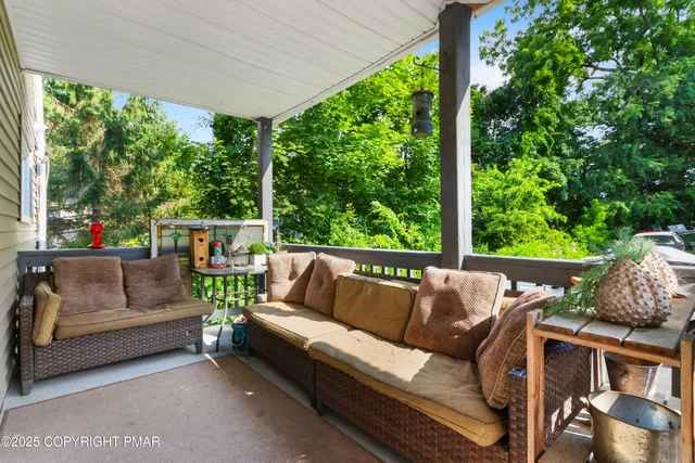 a outdoor living space with furniture and garden view
