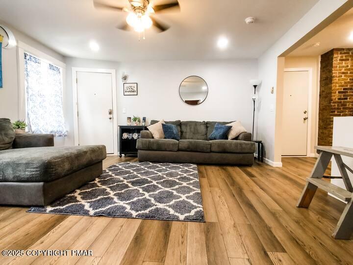 36 Main Street Delaware Water Gap, PA 18327 - Photo 9 of 37 a living room with furniture and a large window