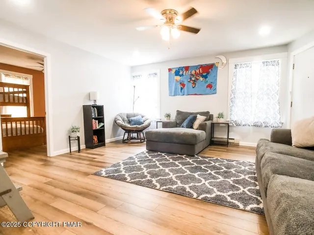 a living room with furniture and a rug