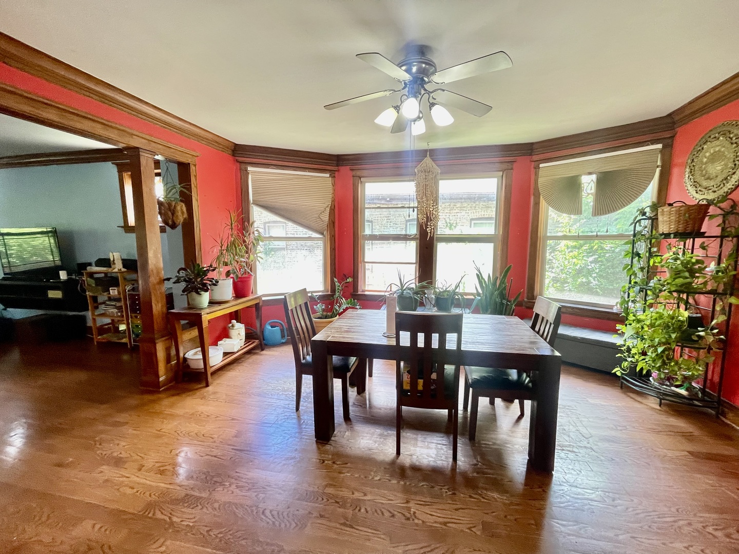 7916 South Constance Avenue Chicago, IL 60617 - Photo 8 of 28 a view of a dining room with furniture window and wooden floor