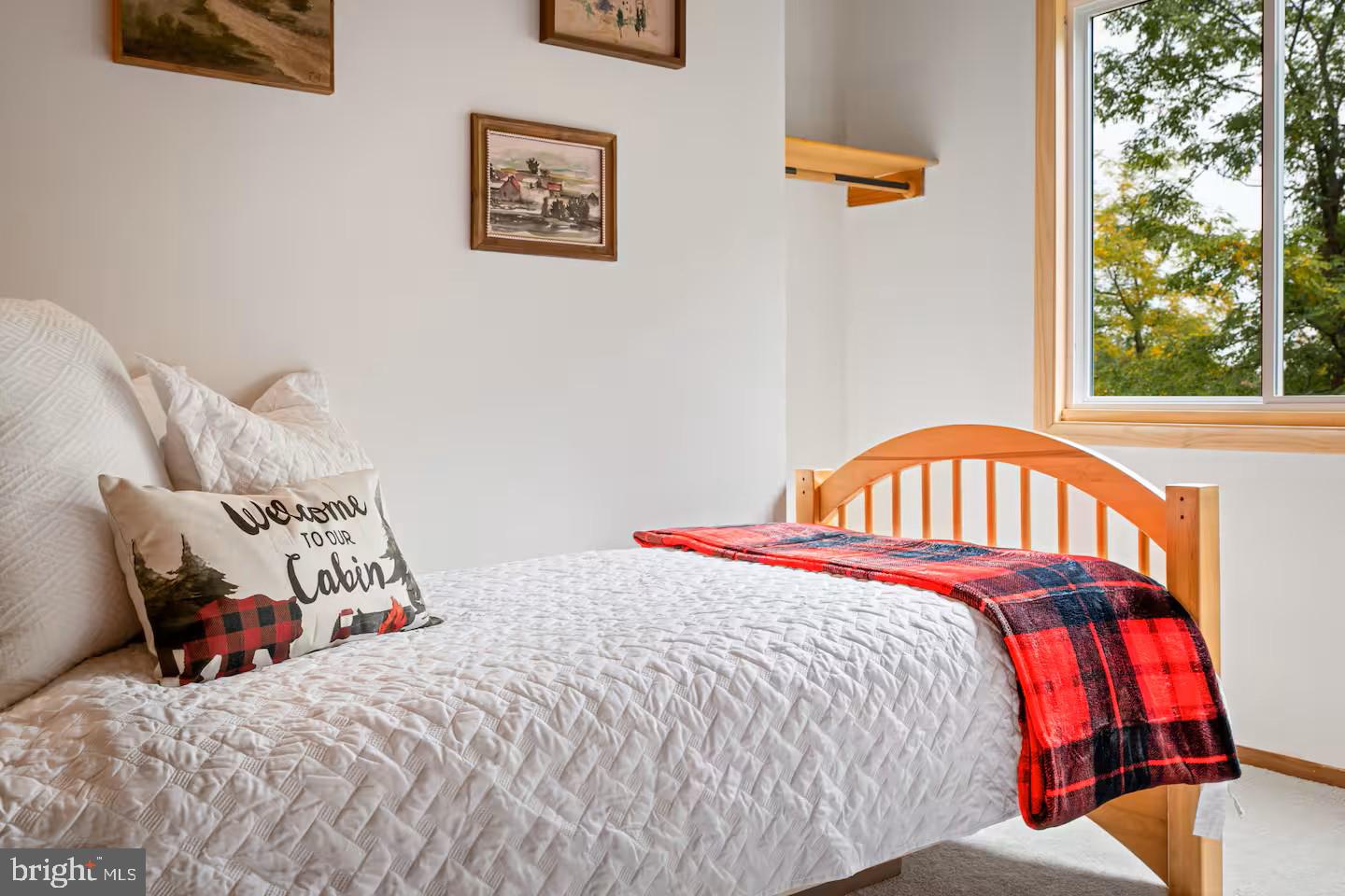 248 The Hill Road Basye, VA 22810 - Photo 11 of 21 a bedroom with a bed and a window