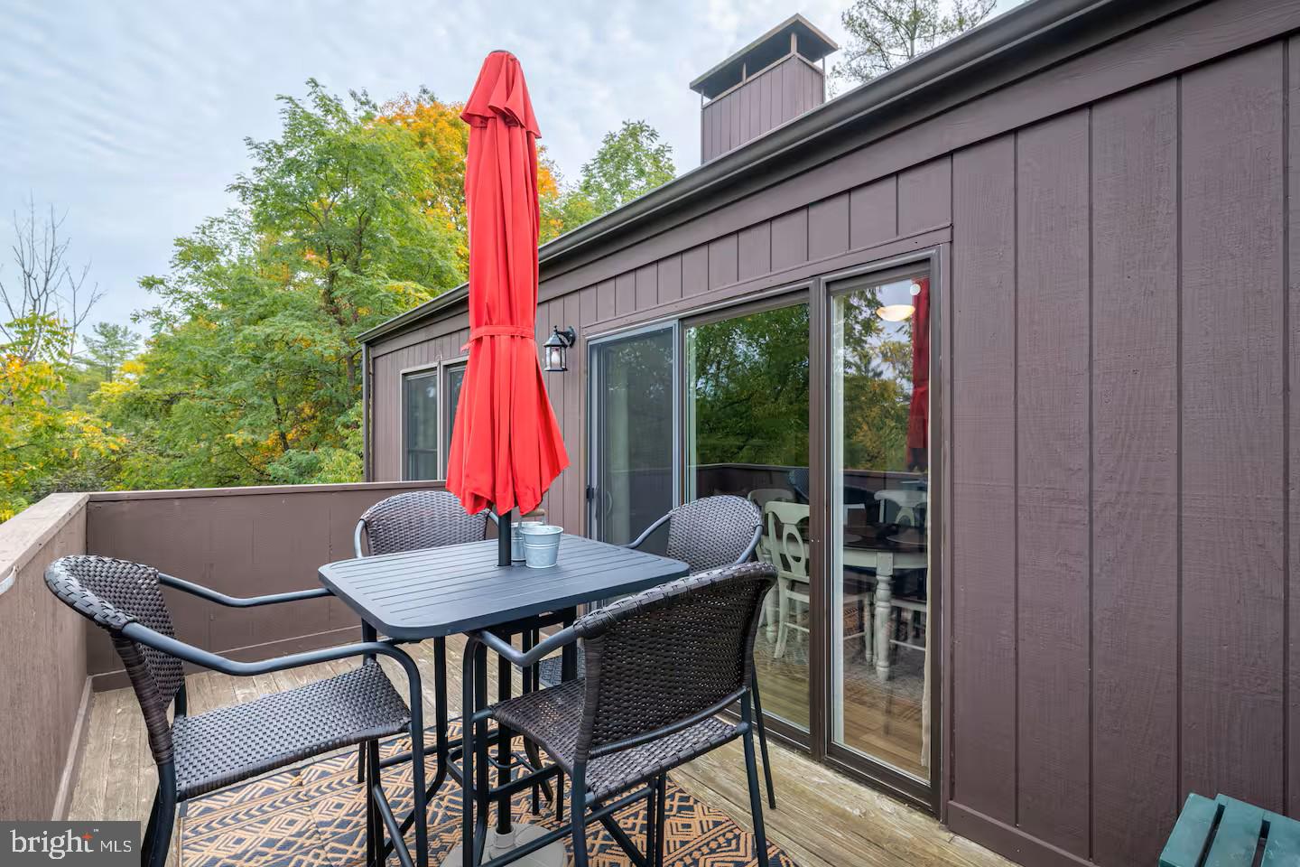 248 The Hill Road Basye, VA 22810 - Photo 15 of 21 a view of a patio with a table and chairs and couches