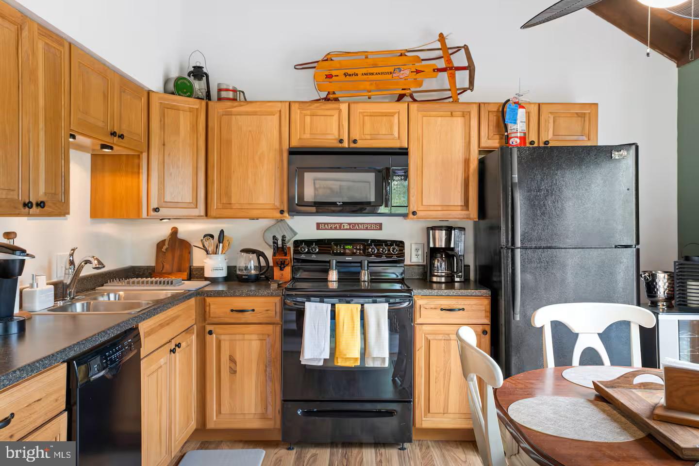 248 The Hill Road Basye, VA 22810 - Photo 3 of 21 a kitchen with stainless steel appliances kitchen island granite countertop a refrigerator a stove top oven a sink and dishwasher