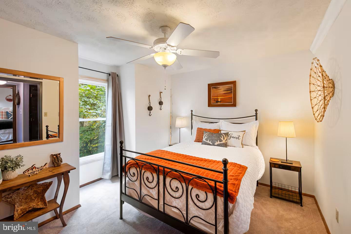 248 The Hill Road Basye, VA 22810 - Photo 8 of 21 a bedroom with a bed and a chandelier