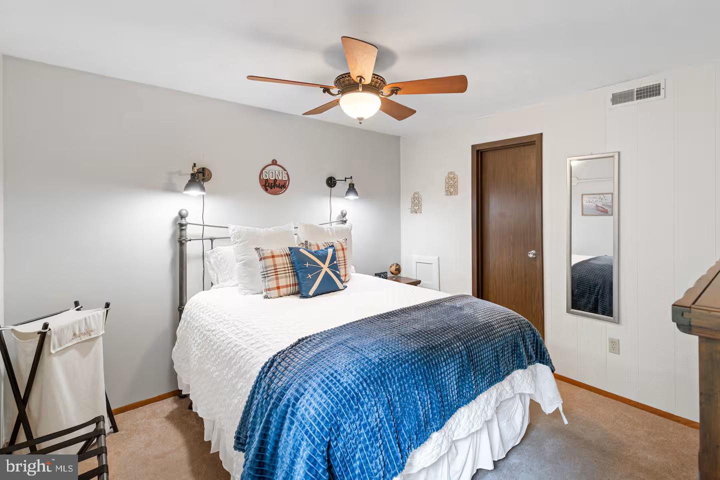 248 The Hill Road Basye, VA 22810 - Photo 9 of 21 a bedroom with a bed and a chandelier