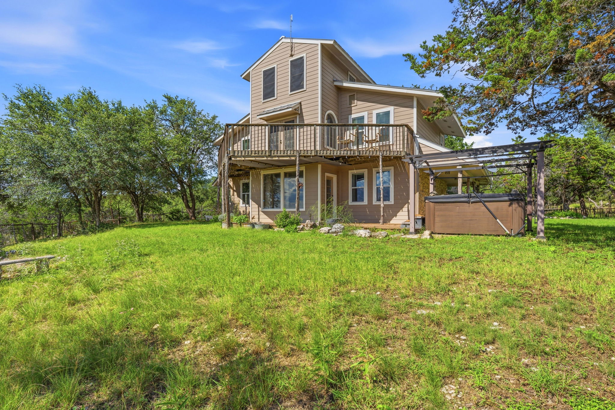 3230 West Fitzhugh Road Dripping Springs, TX 78620 - Photo 22 of 34 A multilevel residence with generous outdoor living spaces and a private spa.