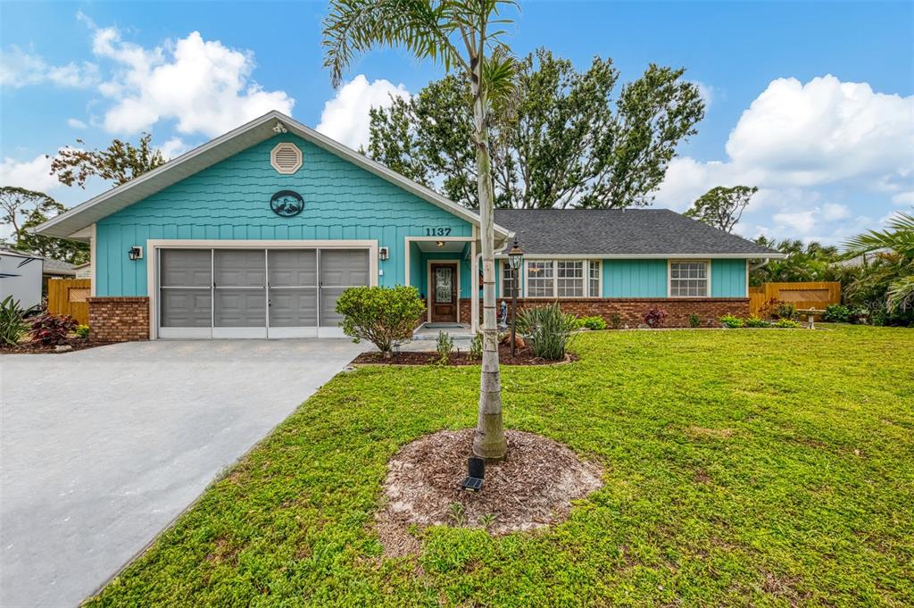 1137 Ponderosa Road Venice, FL 34293 - Photo 1 of 48 a house view with a garden space