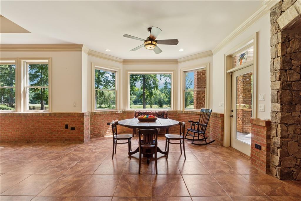 6935 Wakehurst Place Cumming, GA 30040 - Photo 63 of 92 a view of a dining room with furniture window and outside view