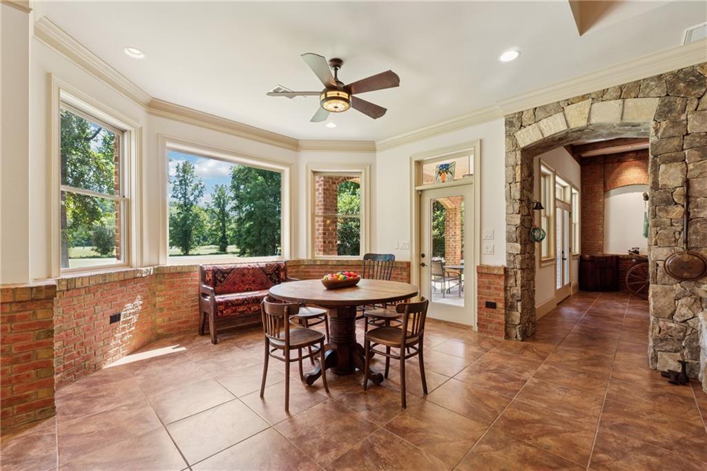 6935 Wakehurst Place Cumming, GA 30040 - Photo 64 of 92 a view of a dining room with furniture window and outside view