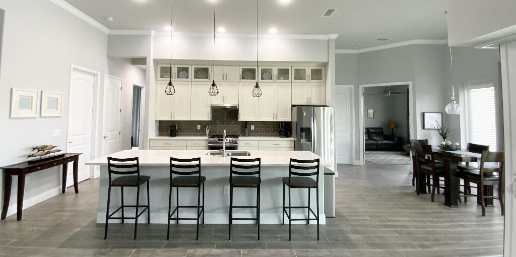 4644 Capri Lane Melbourne, FL 32935 - Photo 12 of 43 a view of a dining room with furniture