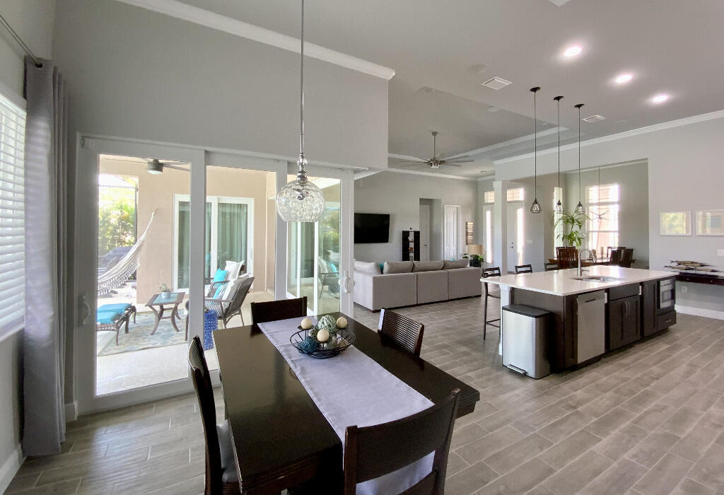 4644 Capri Lane Melbourne, FL 32935 - Photo 14 of 43 a large kitchen with a table and chairs