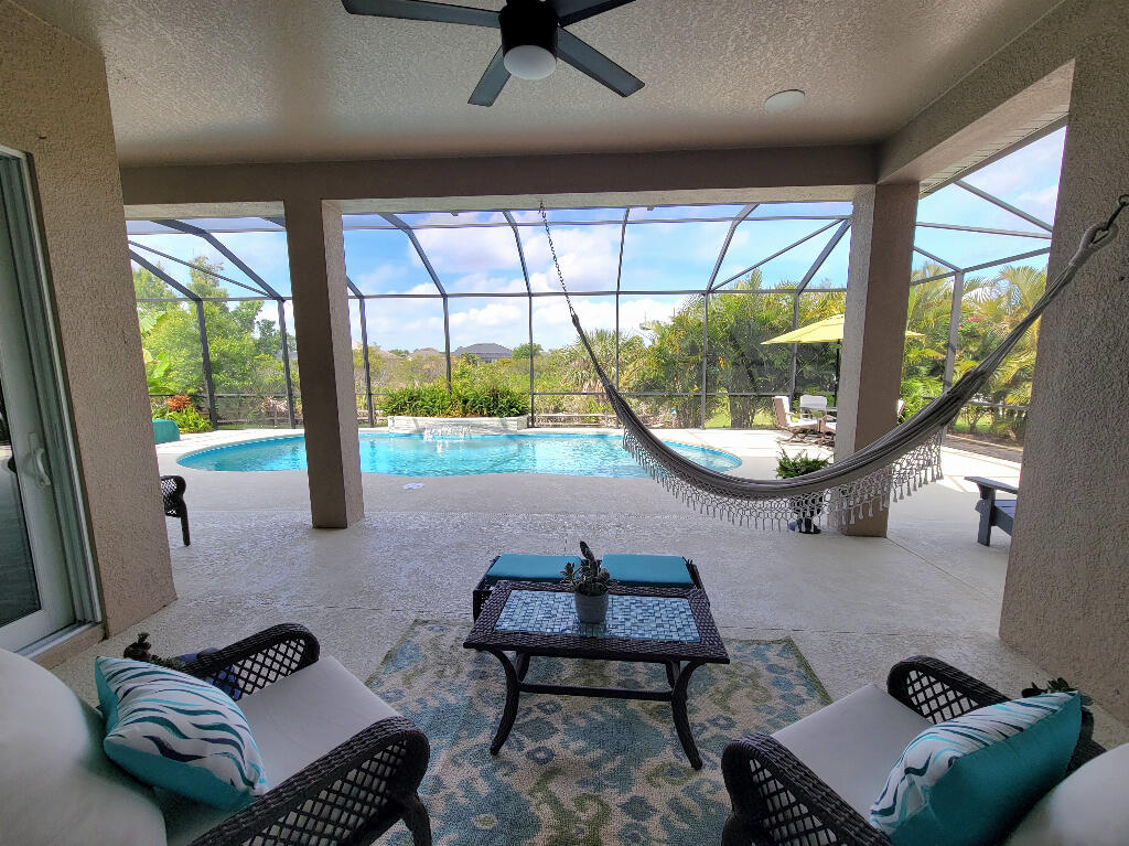 4644 Capri Lane Melbourne, FL 32935 - Photo 15 of 43 a living room with furniture and a large window