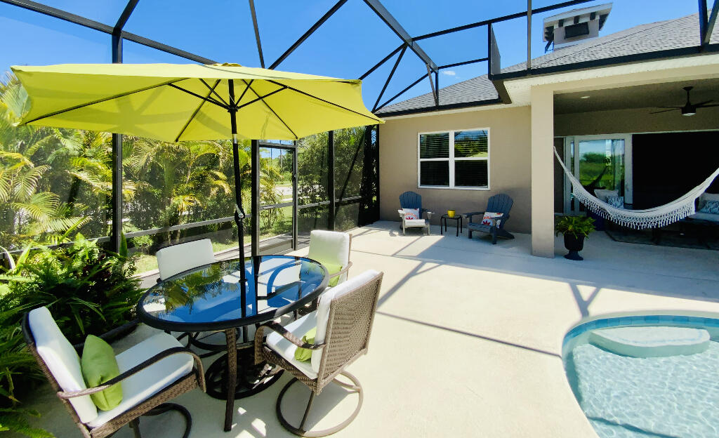 4644 Capri Lane Melbourne, FL 32935 - Photo 18 of 43 a view of a chair and table in the patio