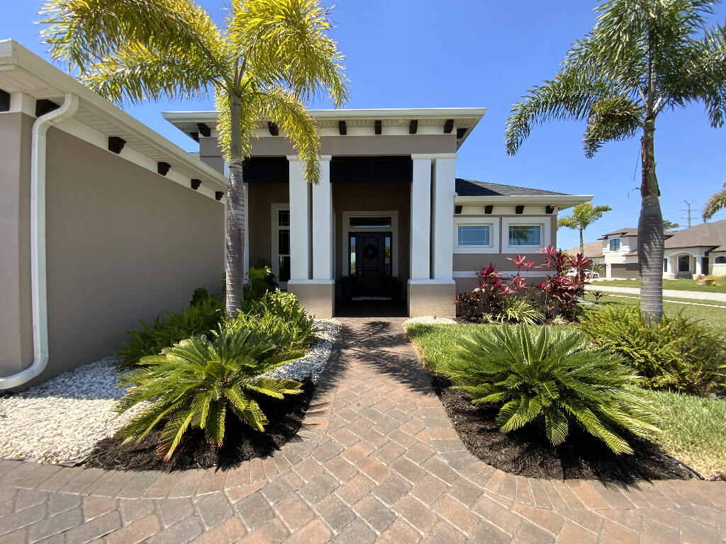 4644 Capri Lane Melbourne, FL 32935 - Photo 2 of 43 a front view of a house with a yard