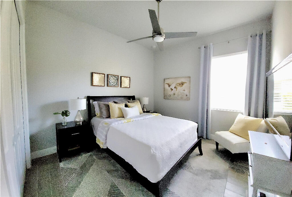 4644 Capri Lane Melbourne, FL 32935 - Photo 28 of 43 a bedroom with a bed and window