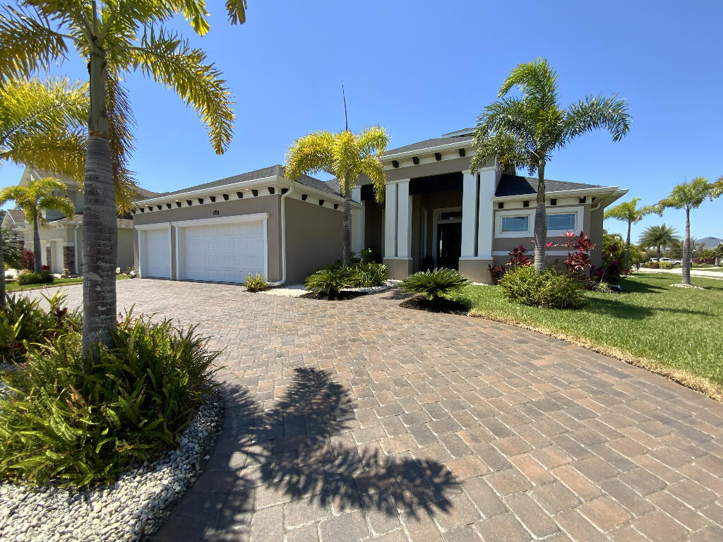 4644 Capri Lane Melbourne, FL 32935 - Photo 3 of 43 a front view of a house with a yard