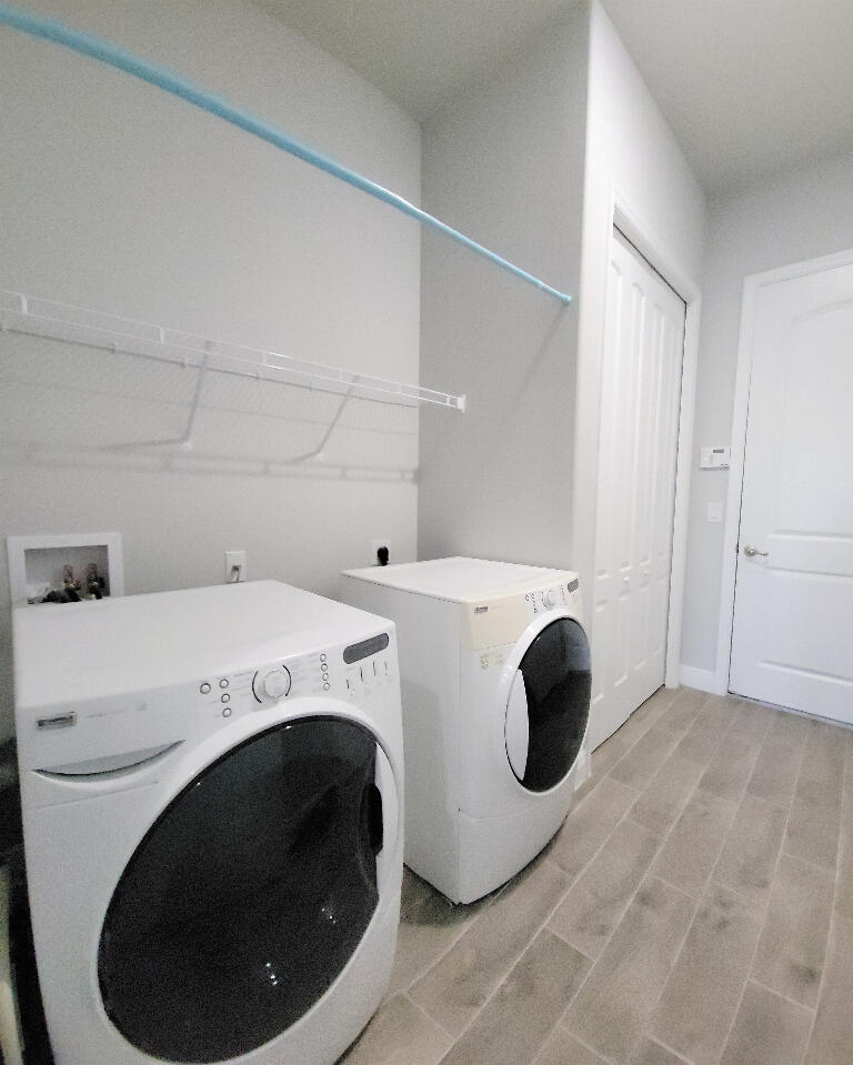 4644 Capri Lane Melbourne, FL 32935 - Photo 33 of 43 a utility room with dryer and washer