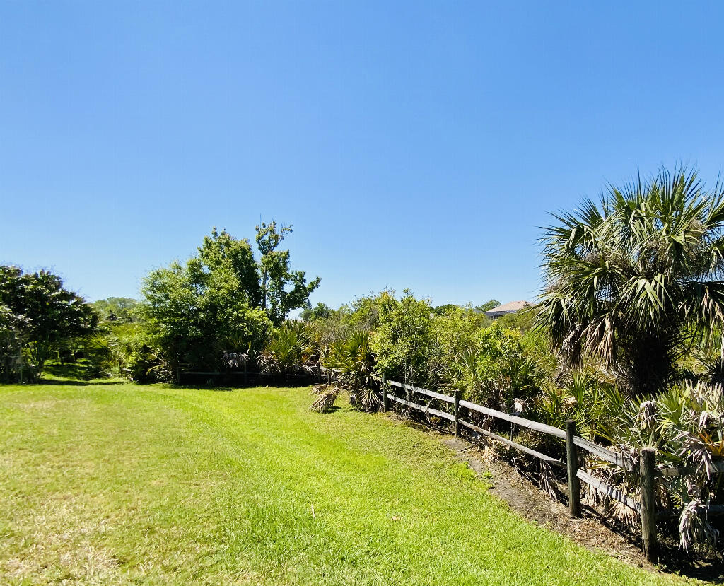 4644 Capri Lane Melbourne, FL 32935 - Photo 43 of 43 a view of a swimming pool with a yard